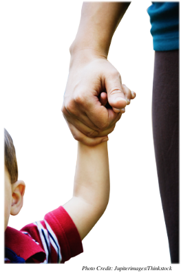 A close-up of an adult holding a child’s hand