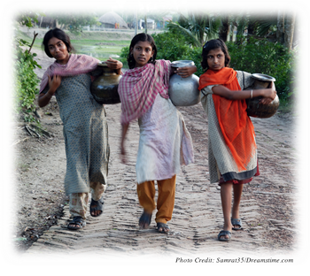 Teens from a rural, possibly non-industrial, society carrying jugs of water