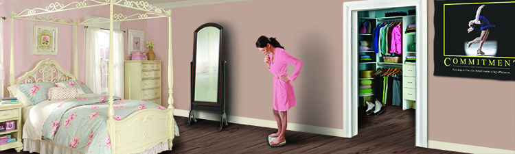 A young woman stands on a scale to measure her weight in a bedroom.
