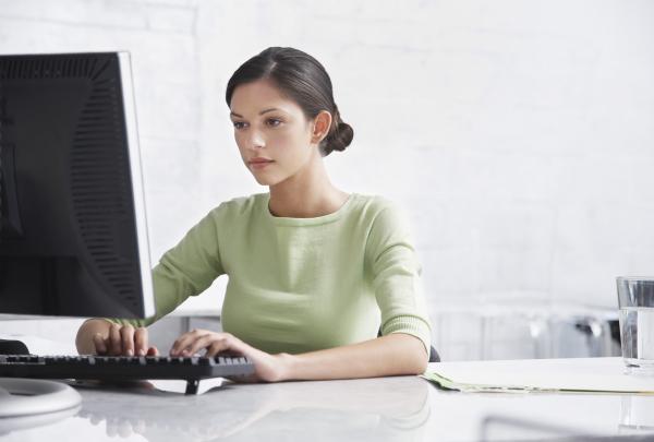 A woman works on an online personality test as part of a job interview.