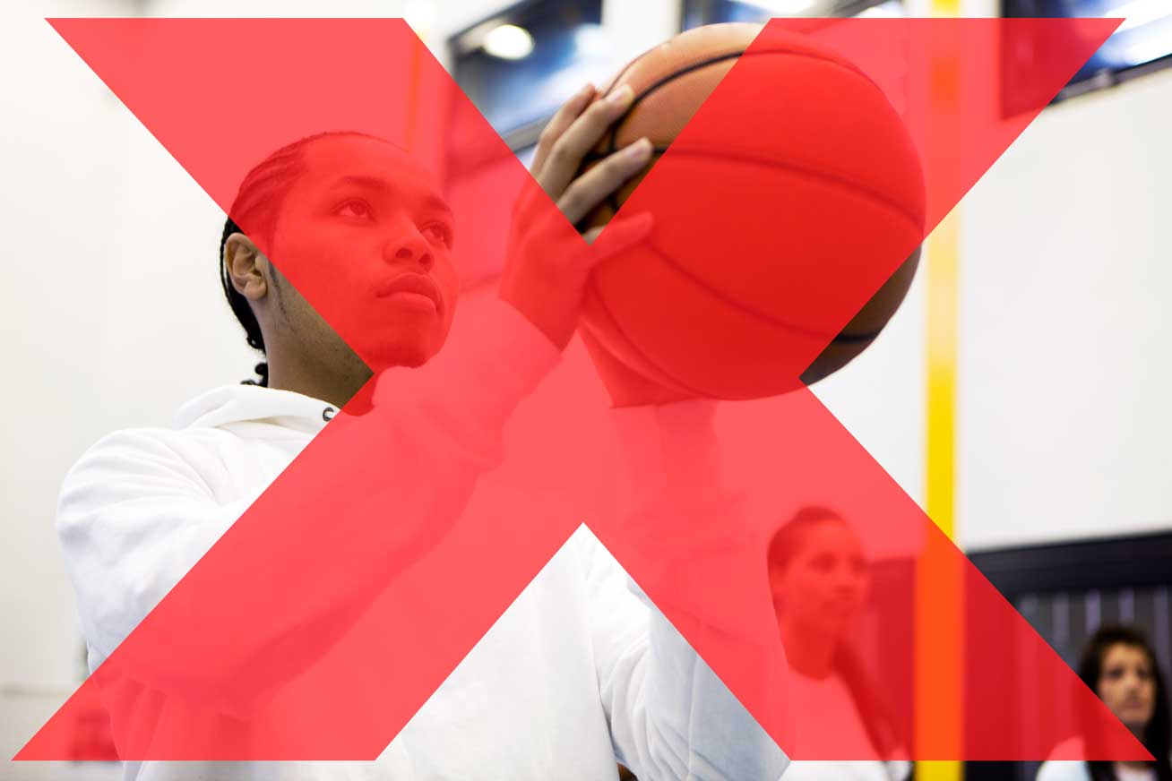 photo of basketball player about to make a shot crossed out with large red X.