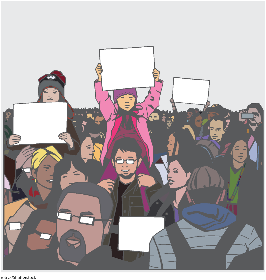 An illustration shows a crowd. A few children are sitting on their fathers' shoulders holding signboards in their hands. A girl holding a sign is the focus of the illustration.