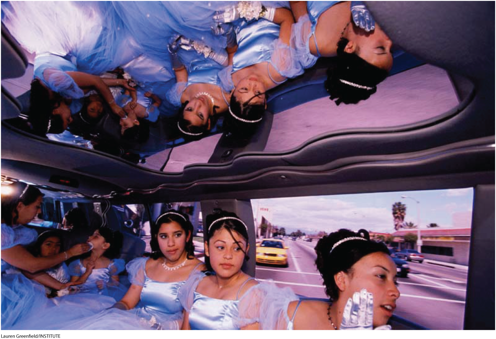 A photo shows a group of girls dressed in similar gowns sitting inside a limousine.