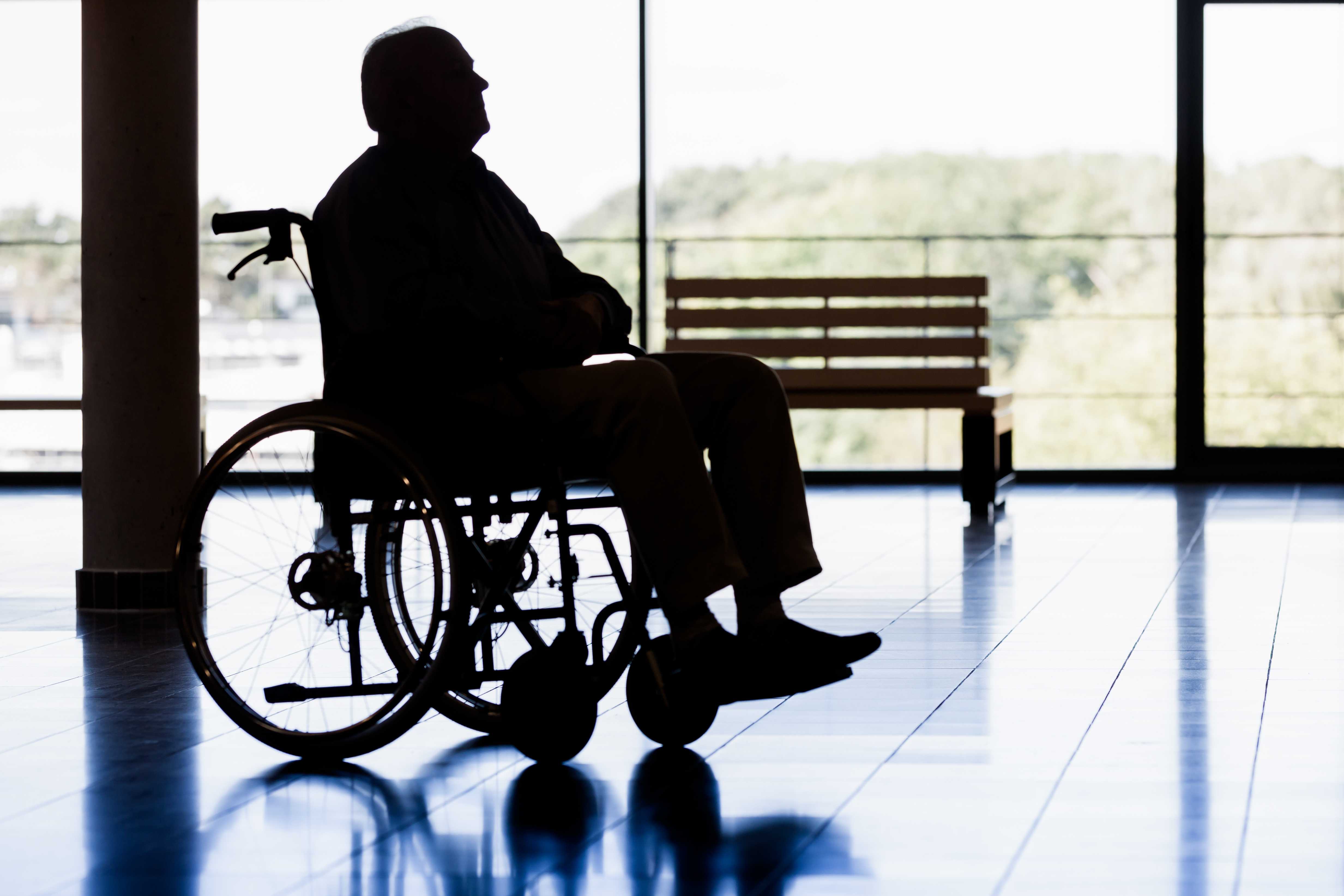 A senior man in a wheelchair.