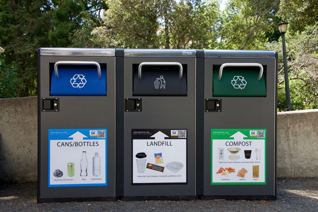 Recycling, landfill and compost garbage bins on University of California Berkeley campus.