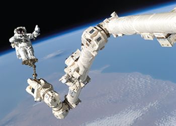 Astronauts above Earth Figure