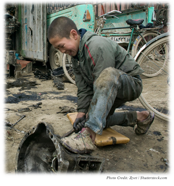 Young boy working at an auto parts store in Afghanistan
