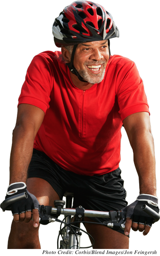Older man smiling on bike