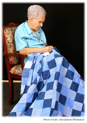 Older woman quilting