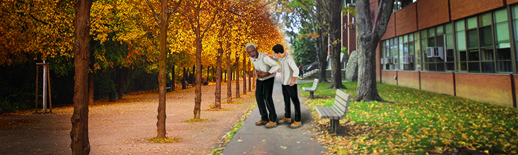 A young man assists an elderly man in a park.