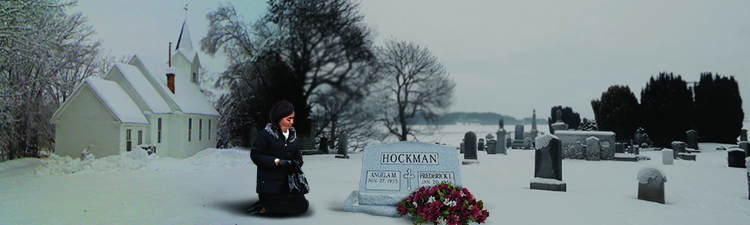 A woman pays her respects at Fred’s grave 
