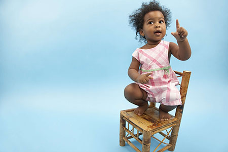 Baby Girl Sitting on Chair