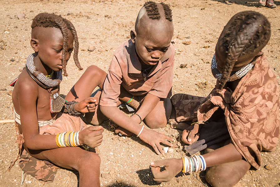 Himba children playing, village near Epupa falls,
      Kunene, Namibia, Africa