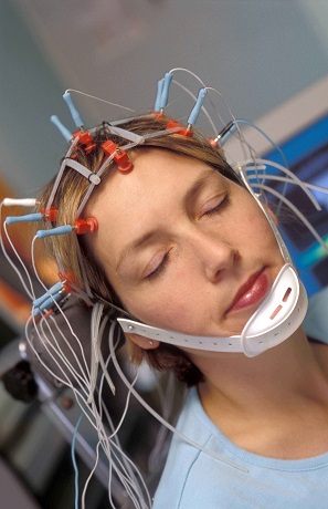 The woman with electrodes placed on the scalp