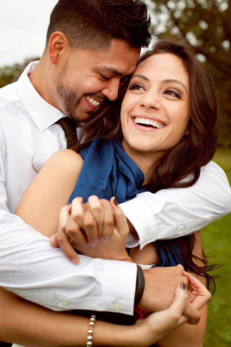 Color image of a man and woman embracing each other, smiling and looking like they are in love.