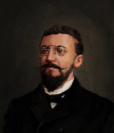 A portrait painting of a middle-aged man with beard and pointed moustache with a pince-nez and dressed in a black suit.