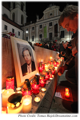Street memorial to Vaclav Havel, surrounded by lit candles