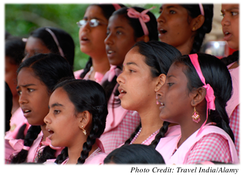 Group of girls in uniforms at a singing performance
