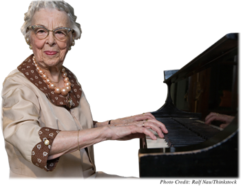 Elderly woman playing the piano
