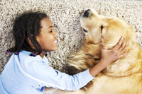 6 years to puberty has an older girl petting a dog.