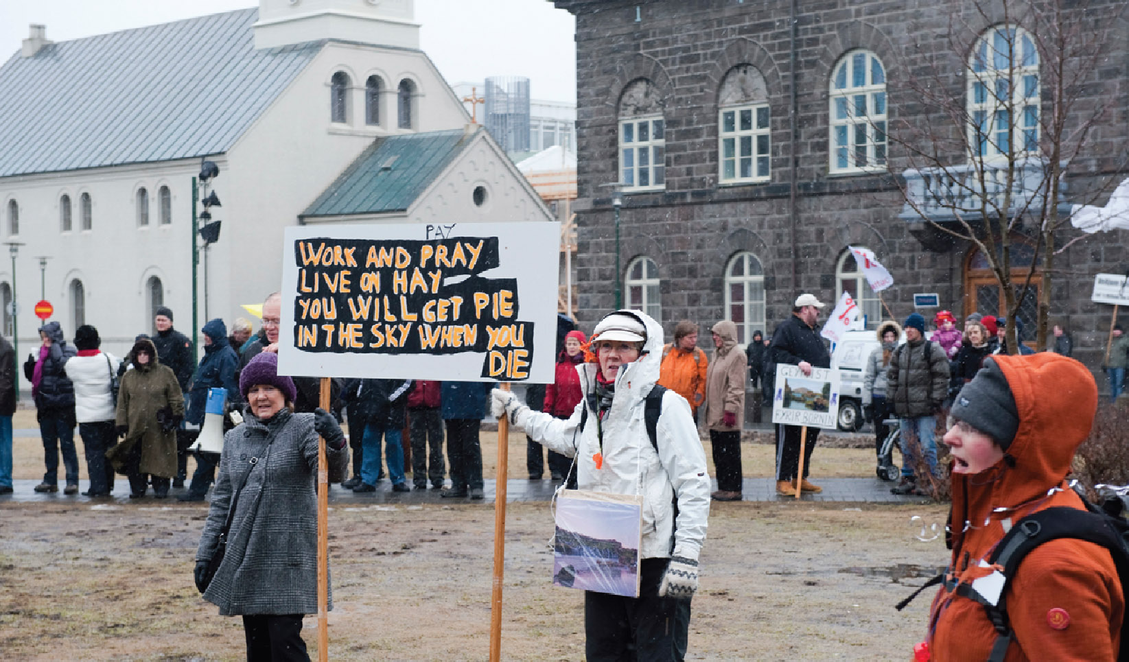 Protesters outside the Icelandic parliament in Reykjavik demand that the government do more to improve conditions for the recently poor.