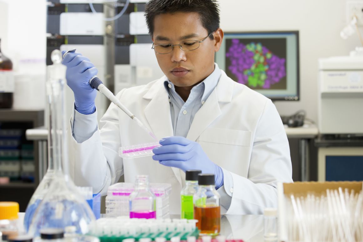 A male scientist works in a laboratory.