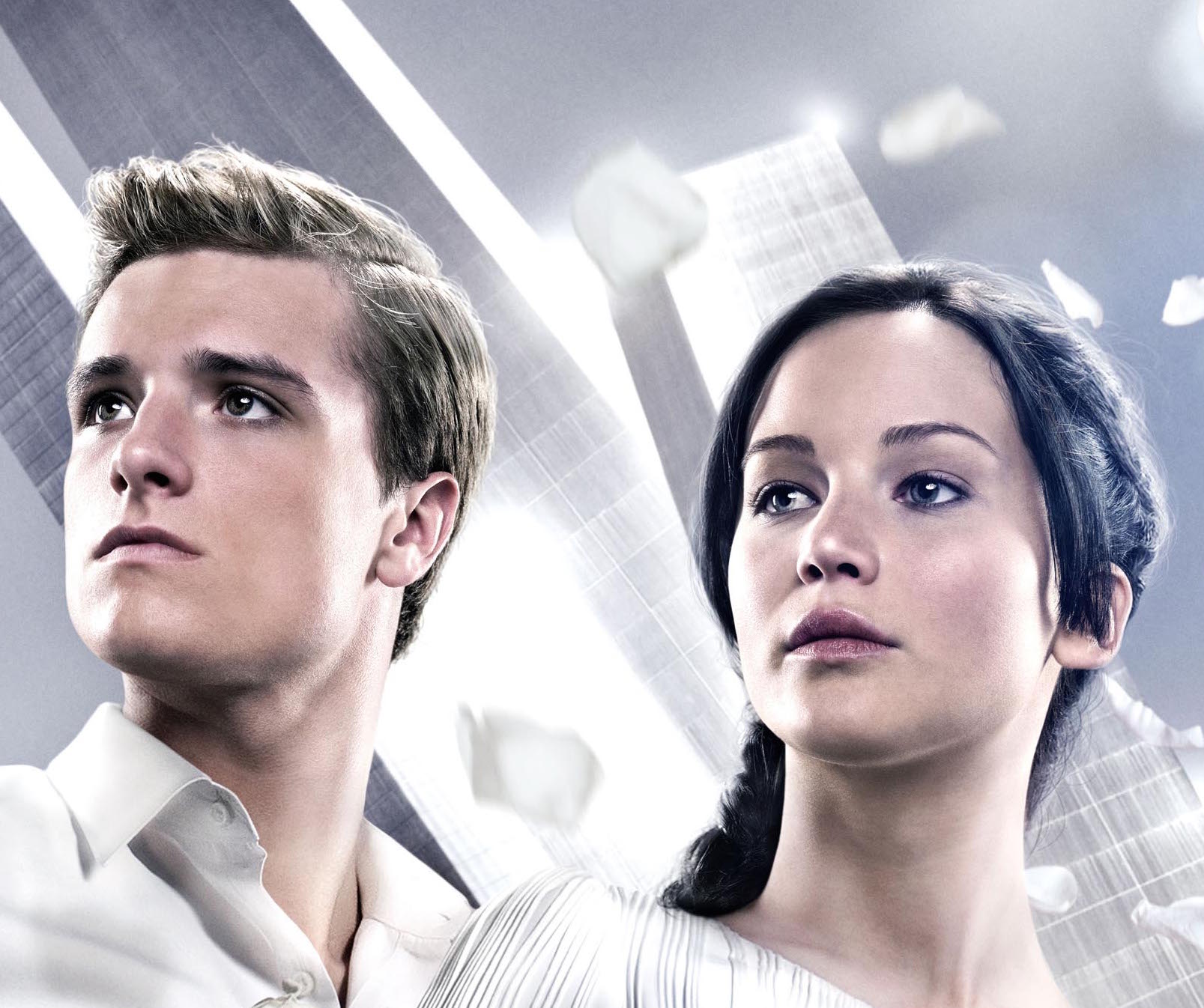 Image of a young man and woman dressed in white with nice features and highlights in the image.