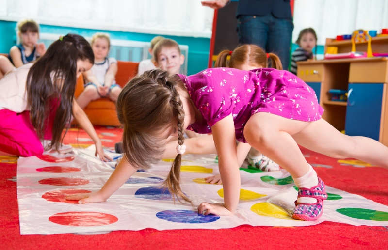 Kindergarten children play in a classroom that improves their motor skills. 