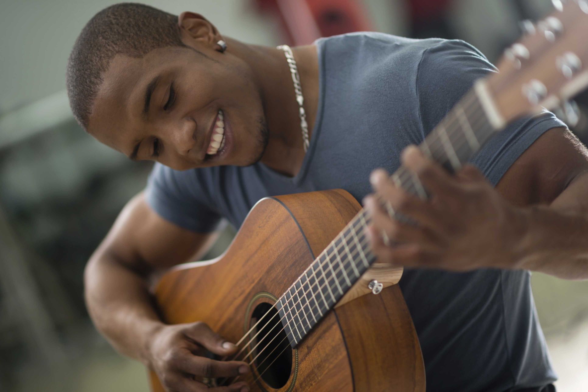A young man plays a musical instrument, which improves his brain’s ability.