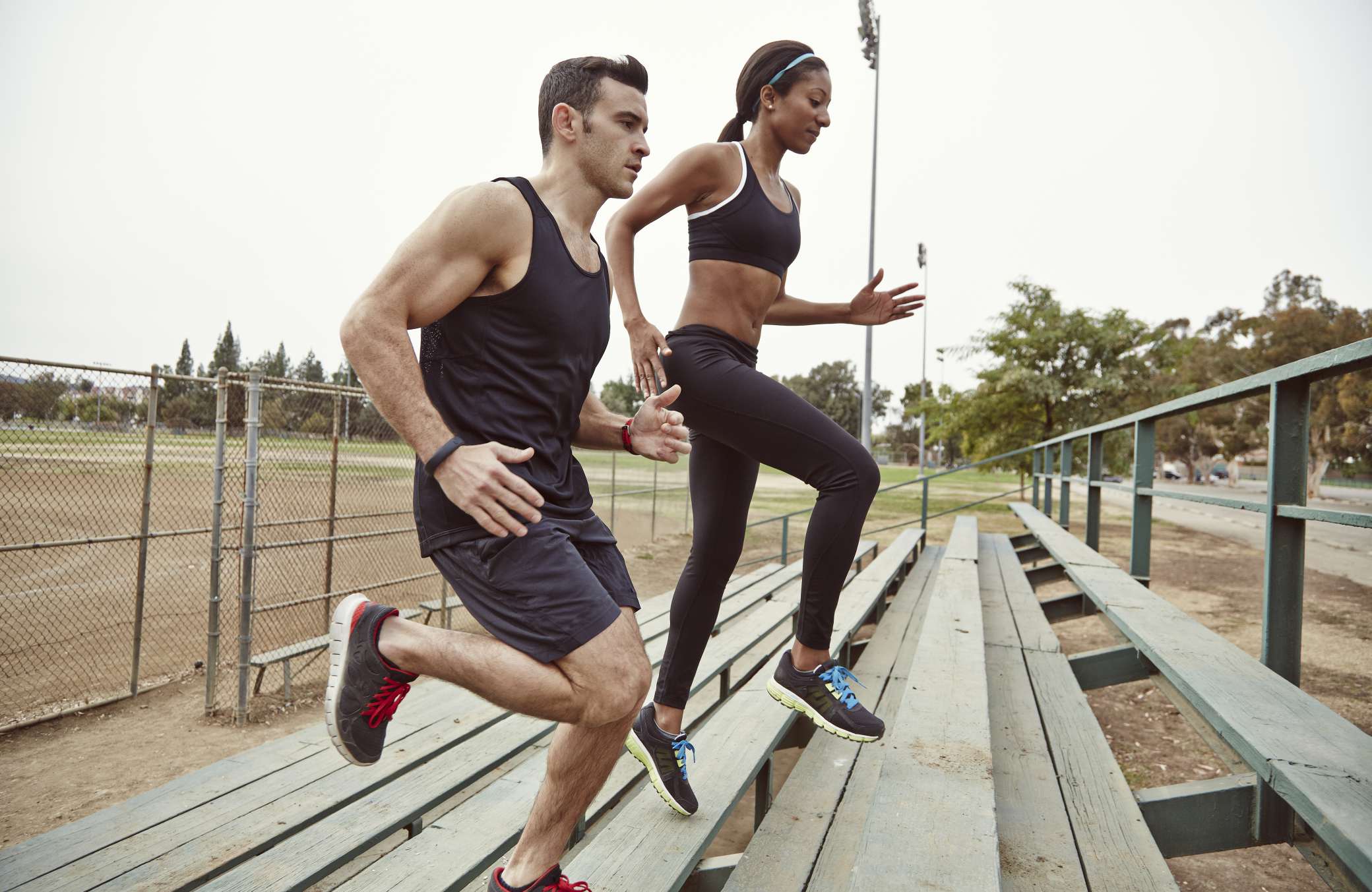 Two people perform physical activity to improve cognitive functioning.