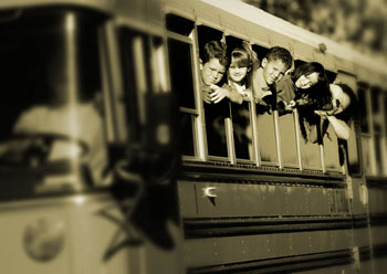 students in a row of school bus windows