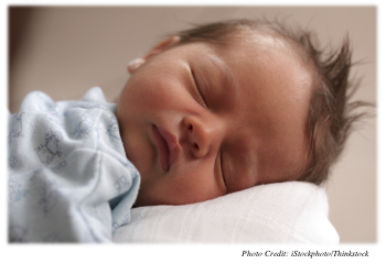 Newborn asleep with completely relaxed face