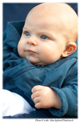Baby staring quietly at something off‐camera